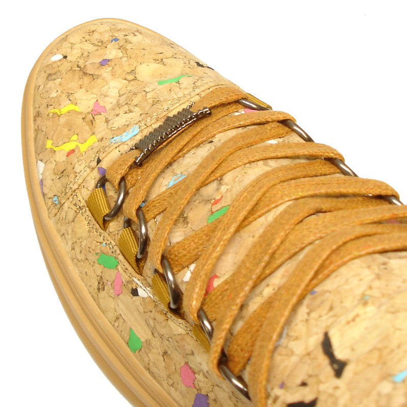 The FI-2254 Brown Casual High Top Sneaker Boot Encore by Fiesso features cork-textured vegan leather, yellow-brown laces, and colorful specks—eye-catching men's fashion sneakers set against a plain white background.