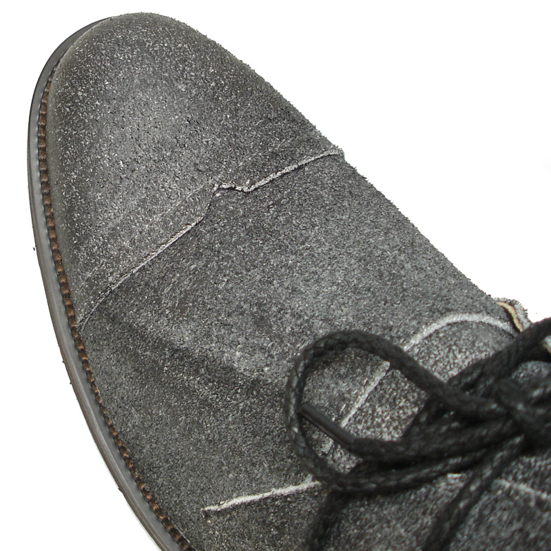 The FI-7002 Grey Encore by Fiesso Genuine Leather Boot features a dark gray suede finish, black laces, tan interior lining, and a dark rubber sole, displayed on a white background. Brand: Fiesso.