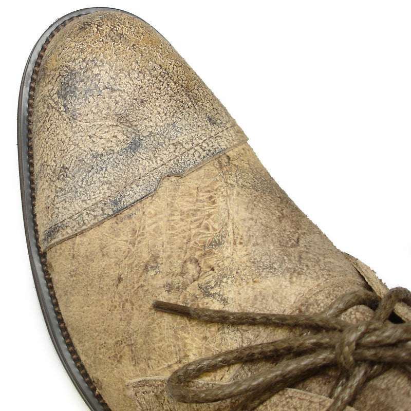 The FI-7002 Brown Encore by Fiesso is a genuine leather men’s boot featuring a scuffed look, dark brown laces, and low heel—classic Fiesso style for a rugged, timeless appeal.