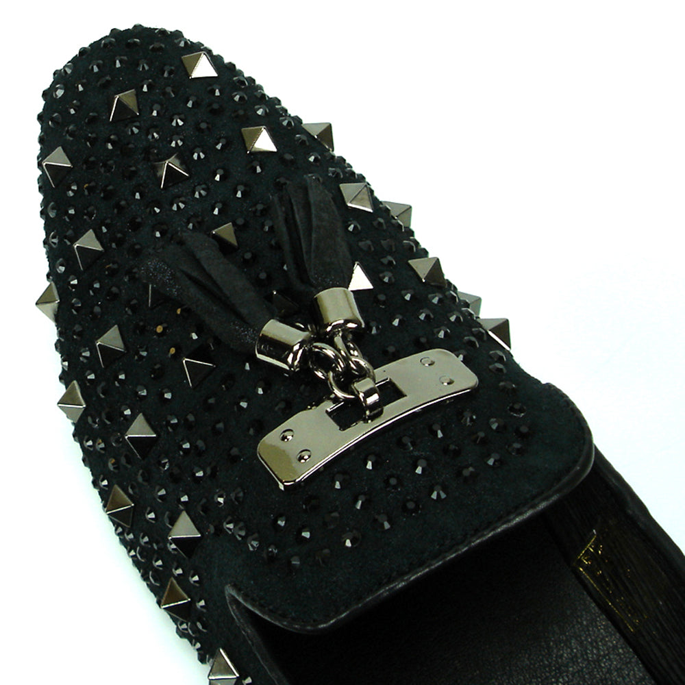 The FI-7005-2 Black With Spikes and Rhinestones Slip-On by Fiesso features black suede, sparkling rhinestones, bold spikes, black tassels, and a metallic front plate—a striking addition to men’s footwear.