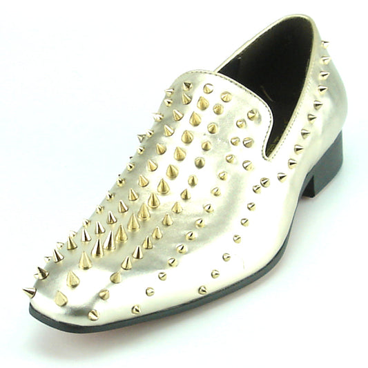Step into style with the FI-7107 Gold Fiesso by Aurelio Garcia—a metallic gold leather slip-on dress shoe from Fiesso, featuring numerous gold spikes on the upper and heel. Photographed against a white background, this striking pair makes an exceptional choice for men’s fashion shoes.
