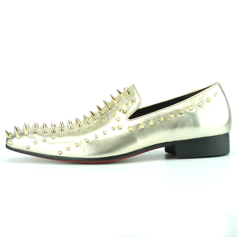 Step into style with the FI-7107 Gold Fiesso by Aurelio Garcia—a metallic gold leather slip-on dress shoe from Fiesso, featuring numerous gold spikes on the upper and heel. Photographed against a white background, this striking pair makes an exceptional choice for men’s fashion shoes.