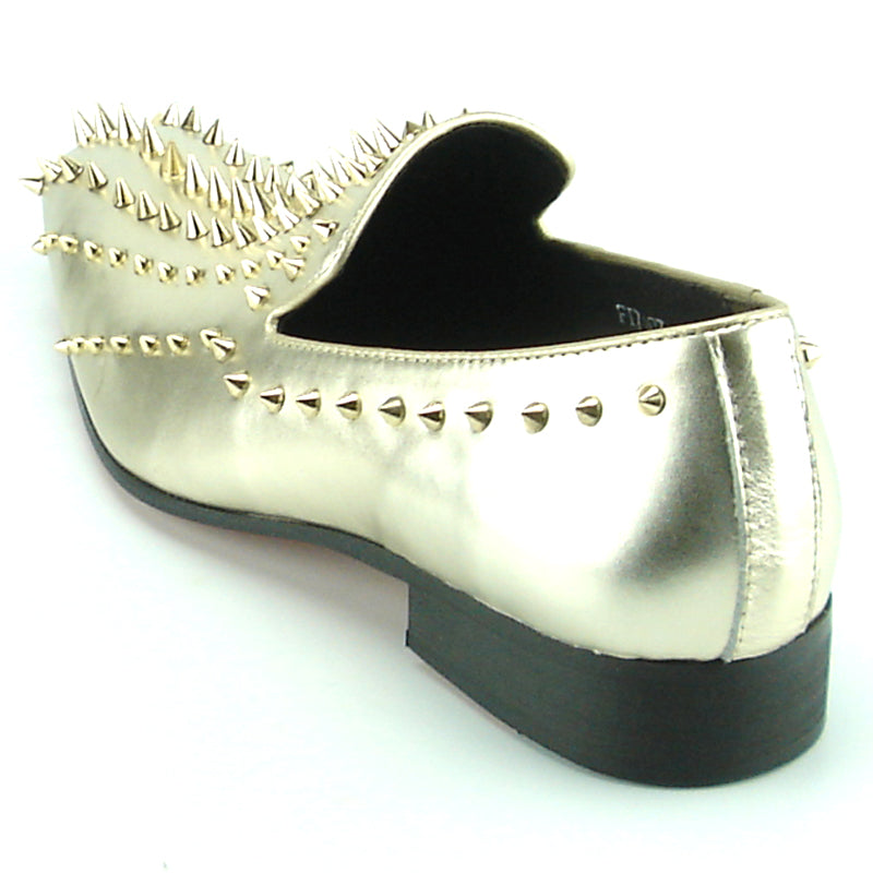 Step into style with the FI-7107 Gold Fiesso by Aurelio Garcia—a metallic gold leather slip-on dress shoe from Fiesso, featuring numerous gold spikes on the upper and heel. Photographed against a white background, this striking pair makes an exceptional choice for men’s fashion shoes.
