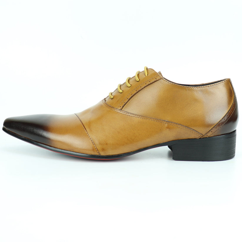 FI-7281 Tan Lace Up Encore by Fiesso is a brown leather dress shoe featuring a pointed toe, black gradient tip, yellow laces, and a low heel, artfully photographed on a white background. This remarkable design from Fiesso exemplifies the impeccable quality of handcrafted leather shoes—making it an essential addition to any men’s fashion shoe collection.