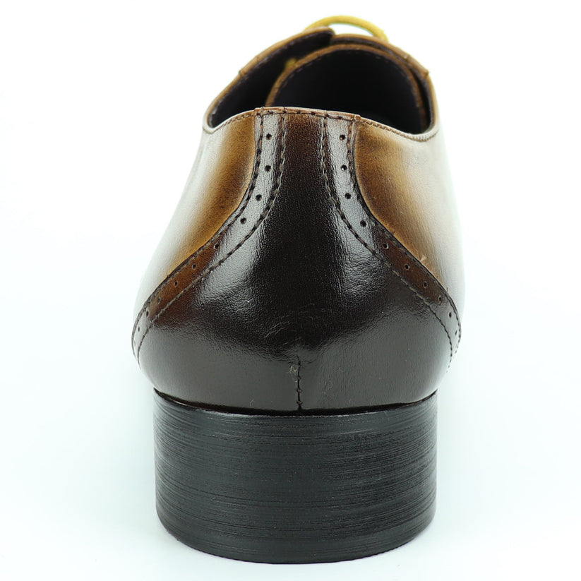 FI-7281 Tan Lace Up Encore by Fiesso is a brown leather dress shoe featuring a pointed toe, black gradient tip, yellow laces, and a low heel, artfully photographed on a white background. This remarkable design from Fiesso exemplifies the impeccable quality of handcrafted leather shoes—making it an essential addition to any men’s fashion shoe collection.