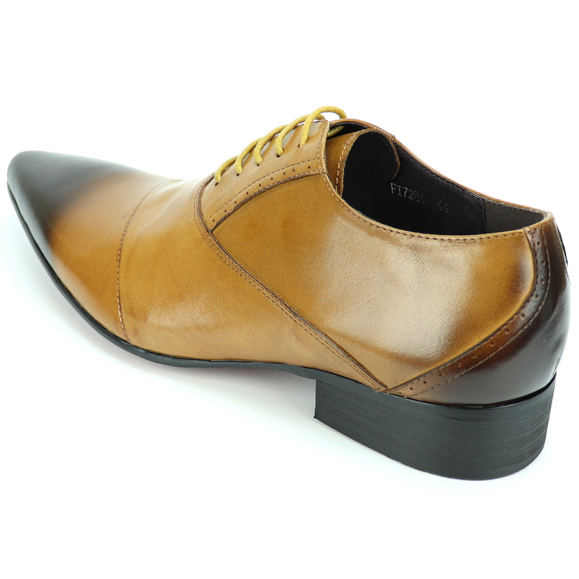 FI-7281 Tan Lace Up Encore by Fiesso is a brown leather dress shoe featuring a pointed toe, black gradient tip, yellow laces, and a low heel, artfully photographed on a white background. This remarkable design from Fiesso exemplifies the impeccable quality of handcrafted leather shoes—making it an essential addition to any men’s fashion shoe collection.