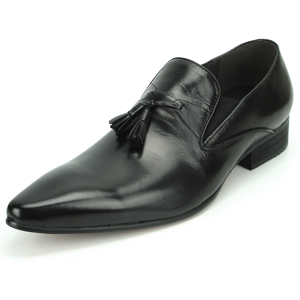 The FI-7287 Black Leather Slip On With Tassel by Fiesso features a pointed toe, low heel, and elegant tassels, inspired by men’s fashion. Displayed on a white background, this loafer adds sophistication to your style.