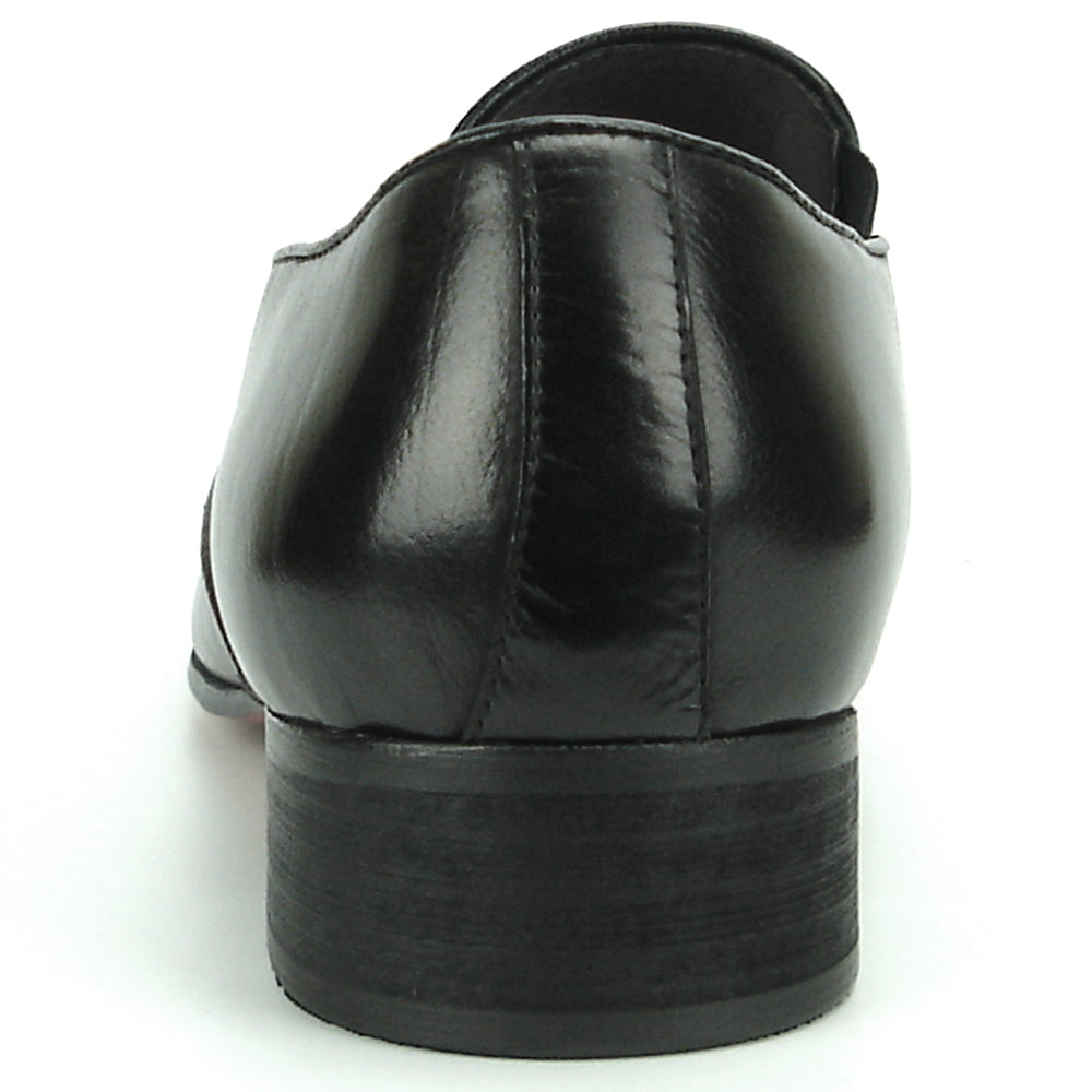 The FI-7287 Black Leather Slip On With Tassel by Fiesso features a pointed toe, low heel, and elegant tassels, inspired by men’s fashion. Displayed on a white background, this loafer adds sophistication to your style.