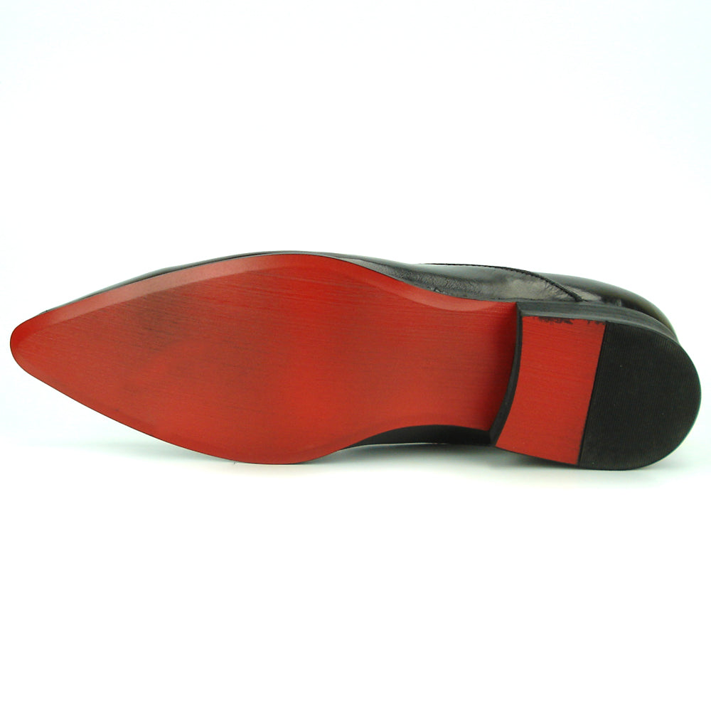 The FI-7287 Black Leather Slip On With Tassel by Fiesso features a pointed toe, low heel, and elegant tassels, inspired by men’s fashion. Displayed on a white background, this loafer adds sophistication to your style.