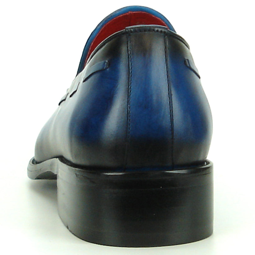 Certainly! Here’s a rewritten version using your specified product data: The FI-8701 Blue Encore by Fiesso is a single blue handcrafted leather tassel loafer featuring black accents, a pointed toe, striking red inner lining, and a low black heel—an exceptional addition to any men’s fashion shoe collection from the renowned brand Fiesso.