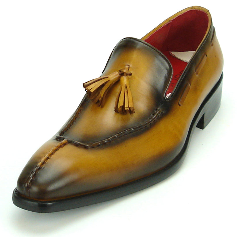 The FI-8701 Tan Encore by Fiesso is a handcrafted men’s leather loafer in brown, with tassels, darker shading on the toe and heel, and a red interior lining.