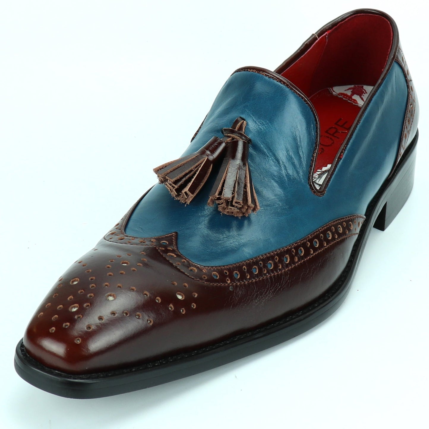 The FI-8705 Burgundy Blue Wing Tip With Tassel Encore by Fiesso features premium leather in burgundy and blue, classic brogue perforations, front tassels, and a black sole—perfect for elevating any outfit with Fiesso’s signature style.