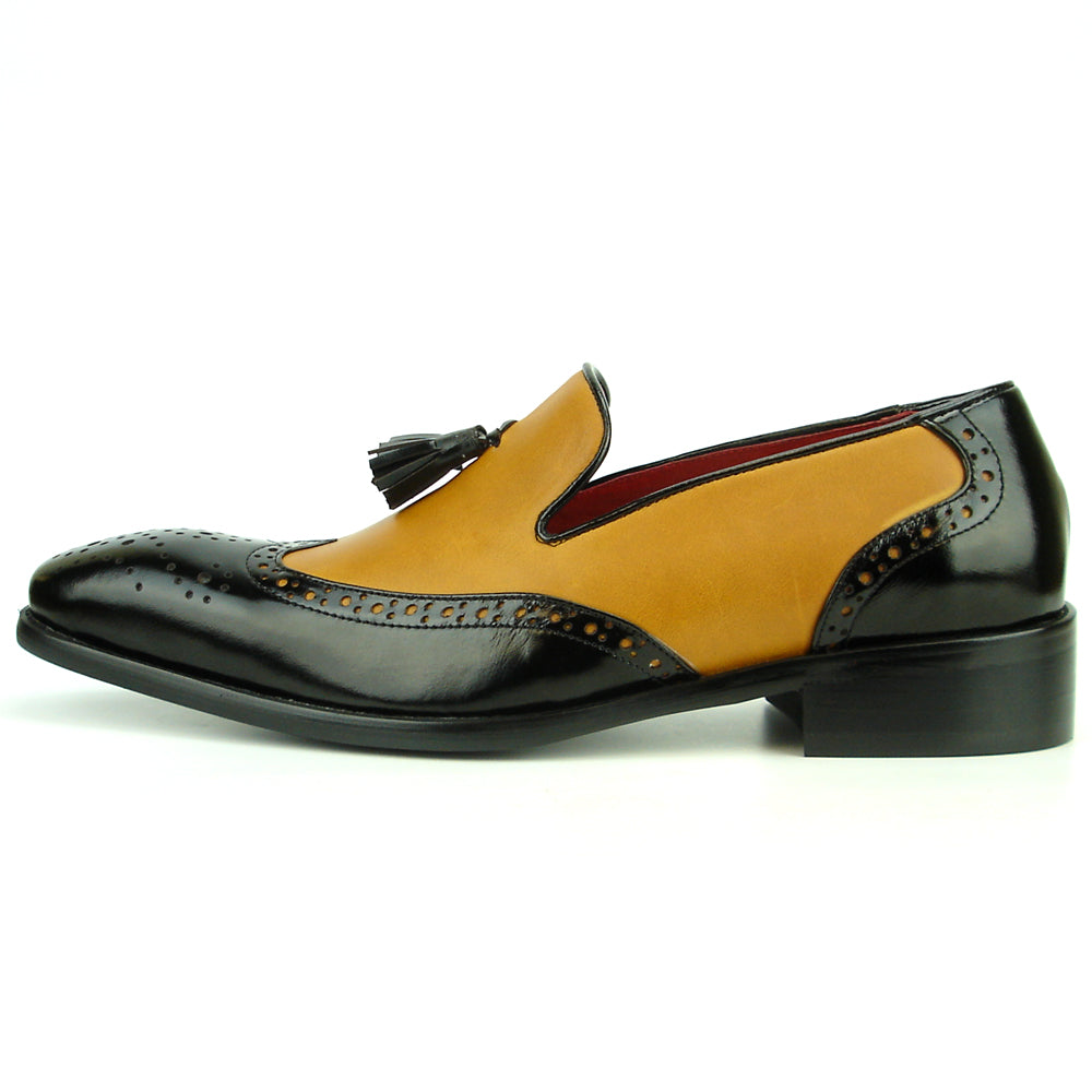 Elevate your style with the Fiesso FI-8705 Black Tan Wing Tip With Tassel Encore—a two-tone men’s loafer featuring black and tan leather, perforated details, a tassel, and low heel. Perfect for classic, fashionable looks.