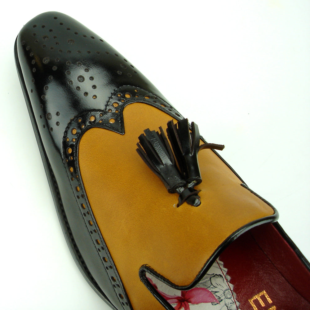 Elevate your style with the Fiesso FI-8705 Black Tan Wing Tip With Tassel Encore—a two-tone men’s loafer featuring black and tan leather, perforated details, a tassel, and low heel. Perfect for classic, fashionable looks.