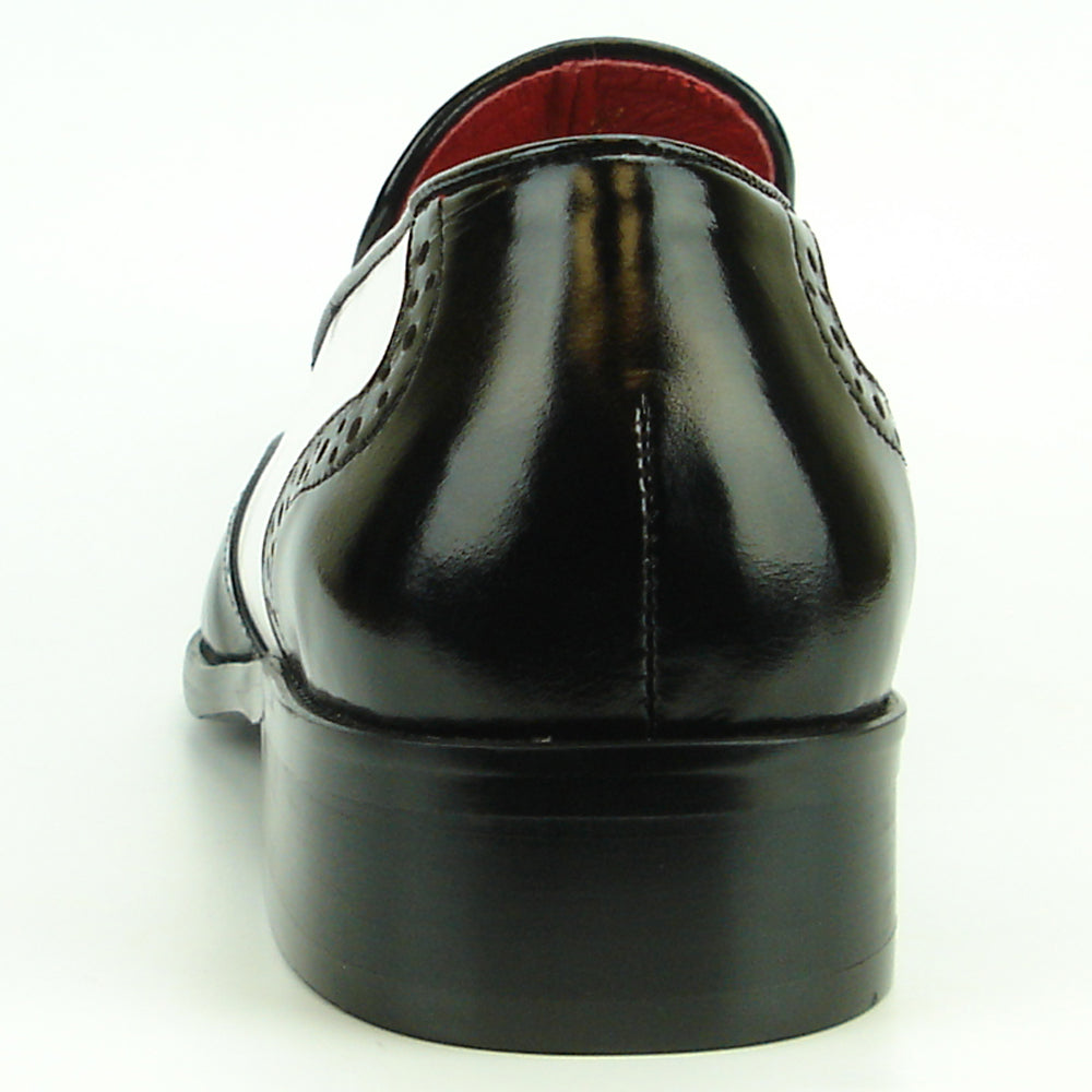 The FI-8705 Black White Wing Tip With Tassel Encore by Fiesso features hand-crafted leather, front tassels, perforated detailing, and a low heel—a true statement in men's fashion.