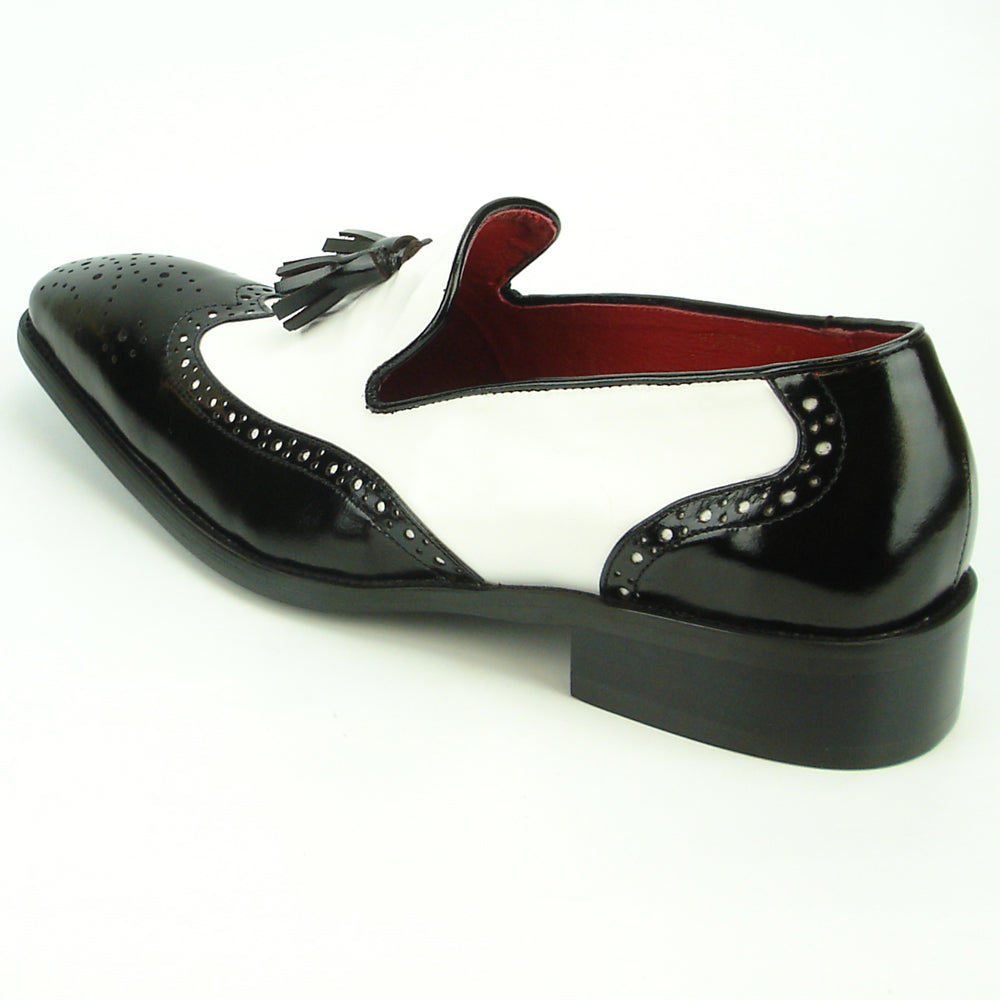 The FI-8705 Black White Wing Tip With Tassel Encore by Fiesso features hand-crafted leather, front tassels, perforated detailing, and a low heel—a true statement in men's fashion.