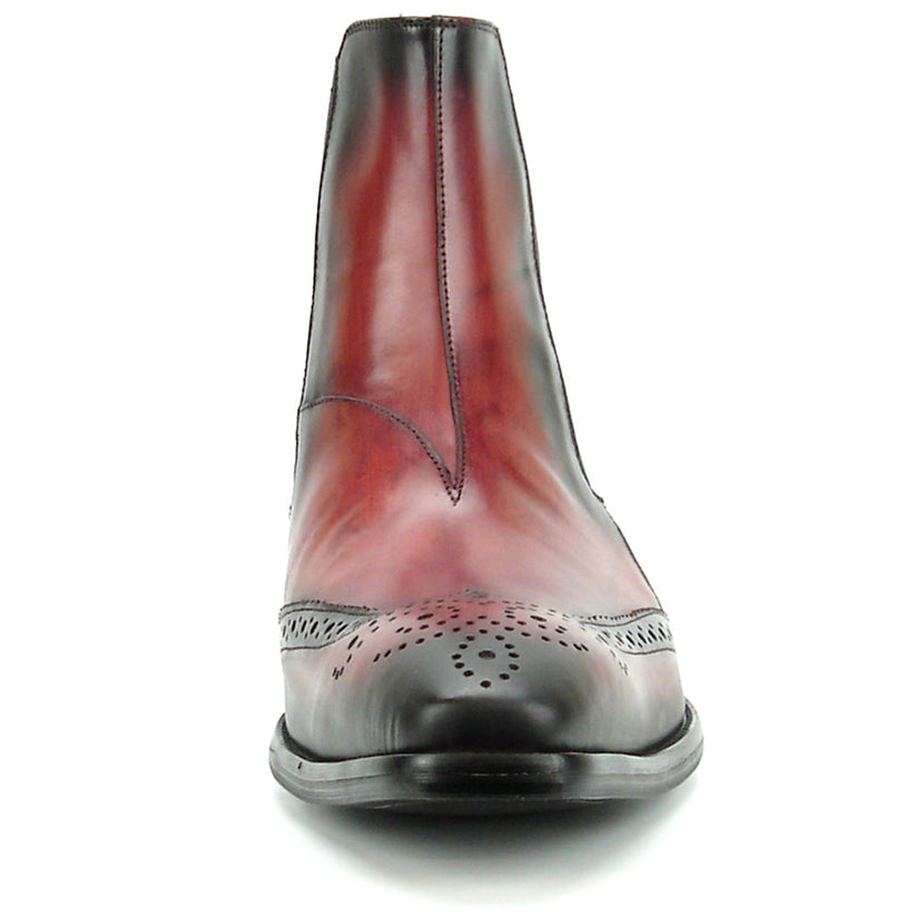 A handcrafted burgundy leather Chelsea boot with black wingtip brogue detailing, elastic side panels, and a low heel—shown on a white background—FI-8708 Wing Tip Boot Encore by Fiesso exemplifies men’s fashion boots from the brand.