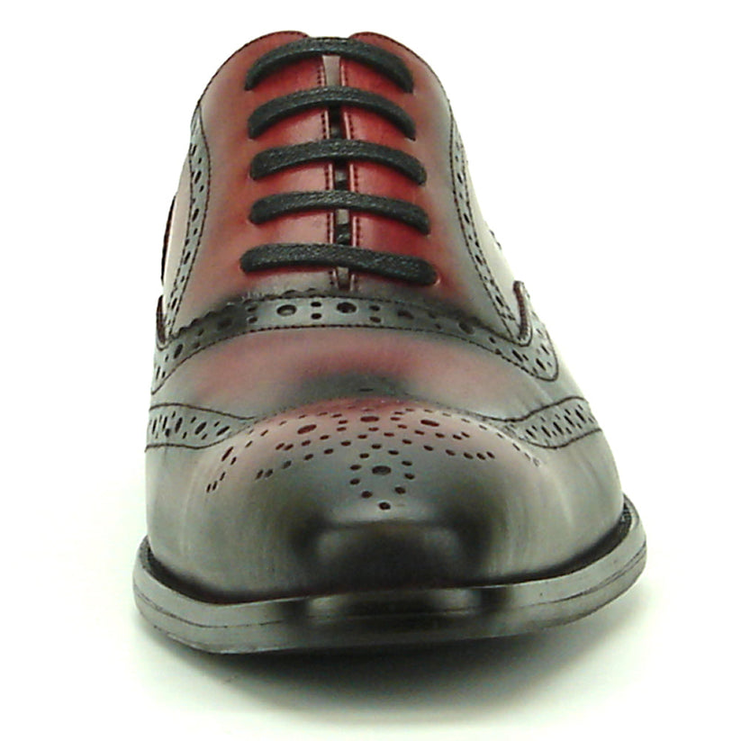 Introducing the FI-8710 Burgundy Wing Tip Encore by Fiesso—a single oxford dress shoe crafted from burgundy and black handcrafted leather, featuring classic brogue detailing, black laces, and a stylish low heel. This exceptional shoe from Fiesso is a standout choice for those seeking distinctive men’s fashion footwear.