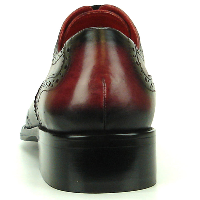 Introducing the FI-8710 Burgundy Wing Tip Encore by Fiesso—a single oxford dress shoe crafted from burgundy and black handcrafted leather, featuring classic brogue detailing, black laces, and a stylish low heel. This exceptional shoe from Fiesso is a standout choice for those seeking distinctive men’s fashion footwear.