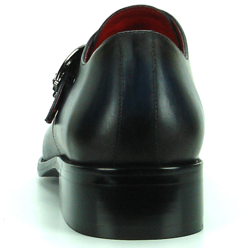 Sleek black men’s leather FI-8712 Black Encore by Fiesso shoes with a pointed toe, low heel, silver buckle detail, and striking red inner lining—these Fiesso monk strap shoes are displayed on a white background.