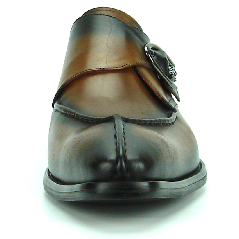 FI-8712 Coffee Encore by Fiesso—this handcrafted men’s dress shoe features rich brown leather, a pointed toe, black accent panels, a sleek side buckle, and a low heel. Displayed against a white background, it exemplifies the distinguished elegance of the Fiesso brand.
