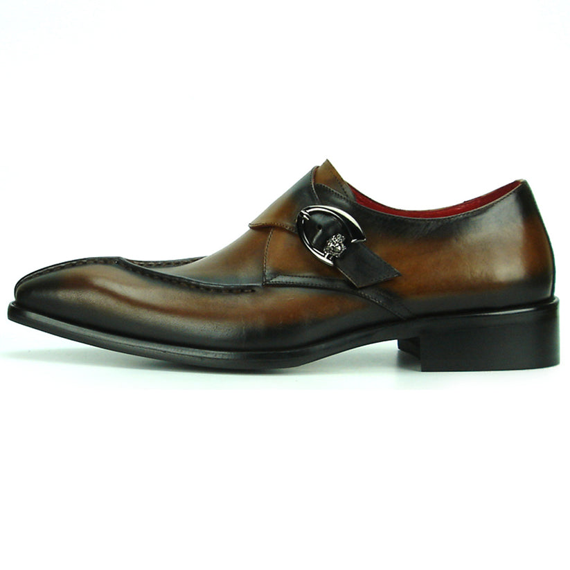 FI-8712 Coffee Encore by Fiesso—this handcrafted men’s dress shoe features rich brown leather, a pointed toe, black accent panels, a sleek side buckle, and a low heel. Displayed against a white background, it exemplifies the distinguished elegance of the Fiesso brand.