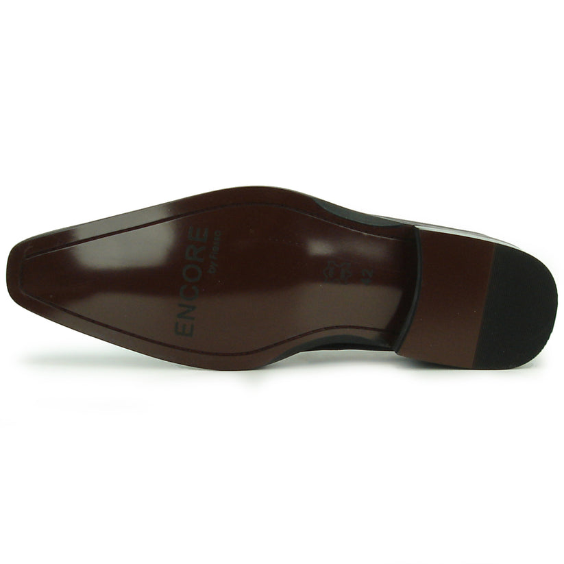 FI-8712 Coffee Encore by Fiesso—this handcrafted men’s dress shoe features rich brown leather, a pointed toe, black accent panels, a sleek side buckle, and a low heel. Displayed against a white background, it exemplifies the distinguished elegance of the Fiesso brand.