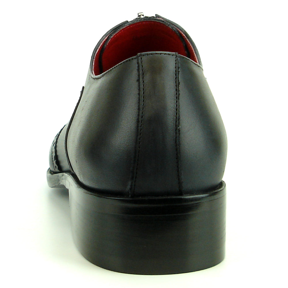 The FI-8714 Black Encore by Fiesso is a handcrafted men's slip-on shoe featuring black leather, brogue detailing, low heel, side zipper, and a bold red lining—delivering sophisticated style from Fiesso.