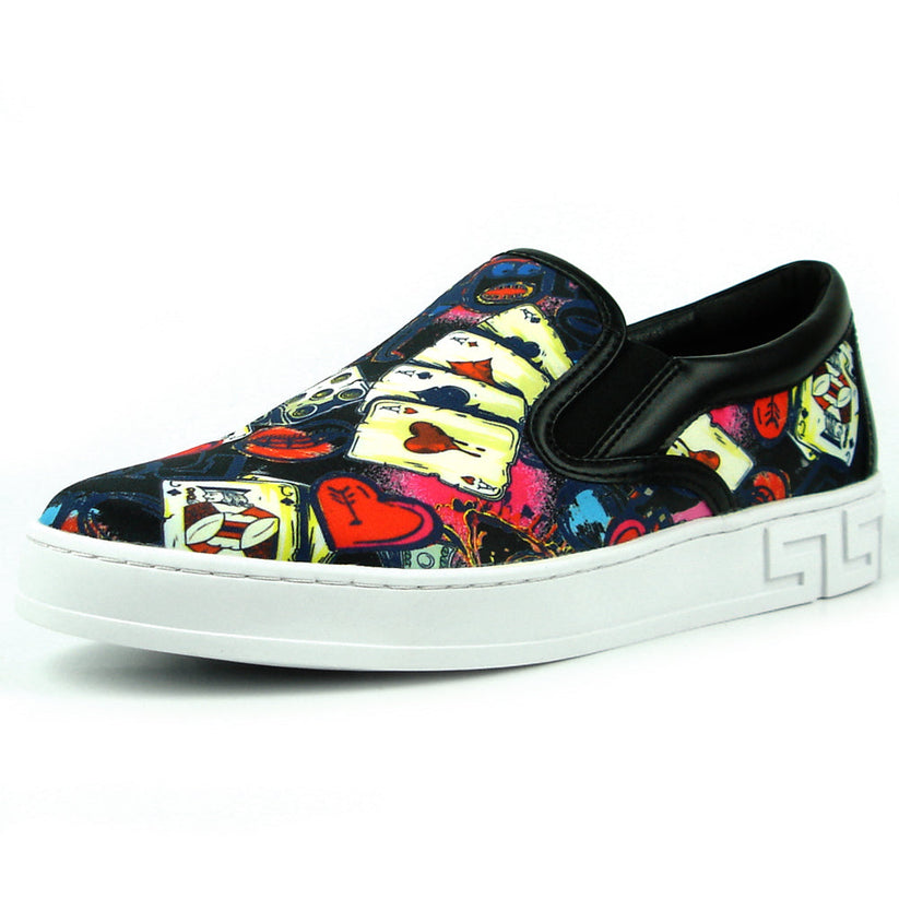 The FI-2344 Ace of Hearts Print Slip on Low Cut Sneaker by Fiesso features a white sole and colorful playing card and dice-themed upper, showcasing Encore by Fiesso’s bold men’s slip-on style.
