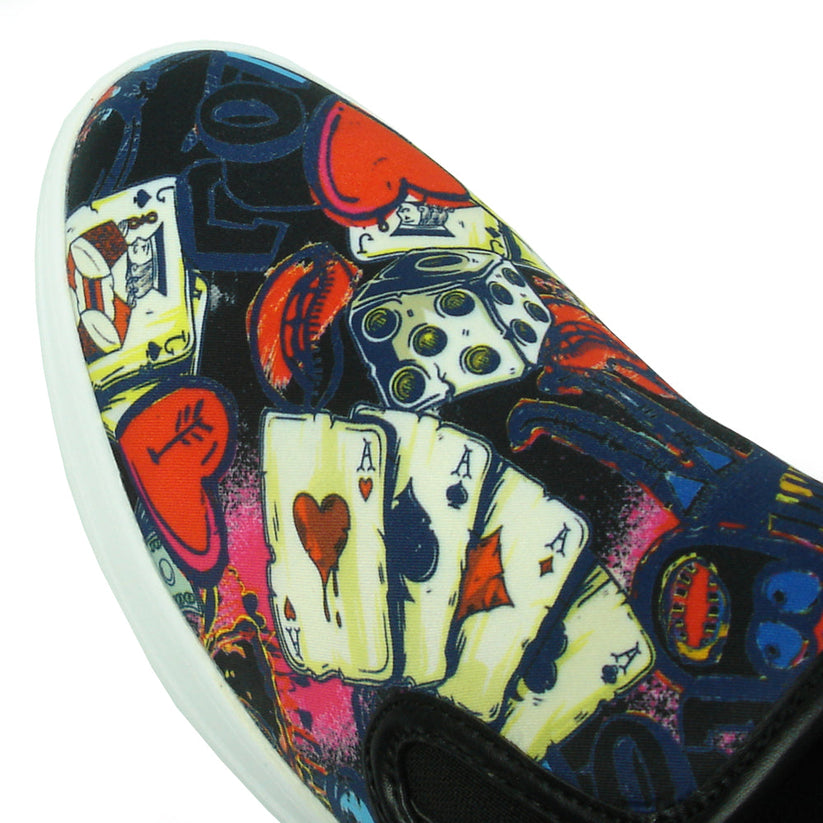 The FI-2344 Ace of Hearts Print Slip on Low Cut Sneaker by Fiesso features a white sole and colorful playing card and dice-themed upper, showcasing Encore by Fiesso’s bold men’s slip-on style.