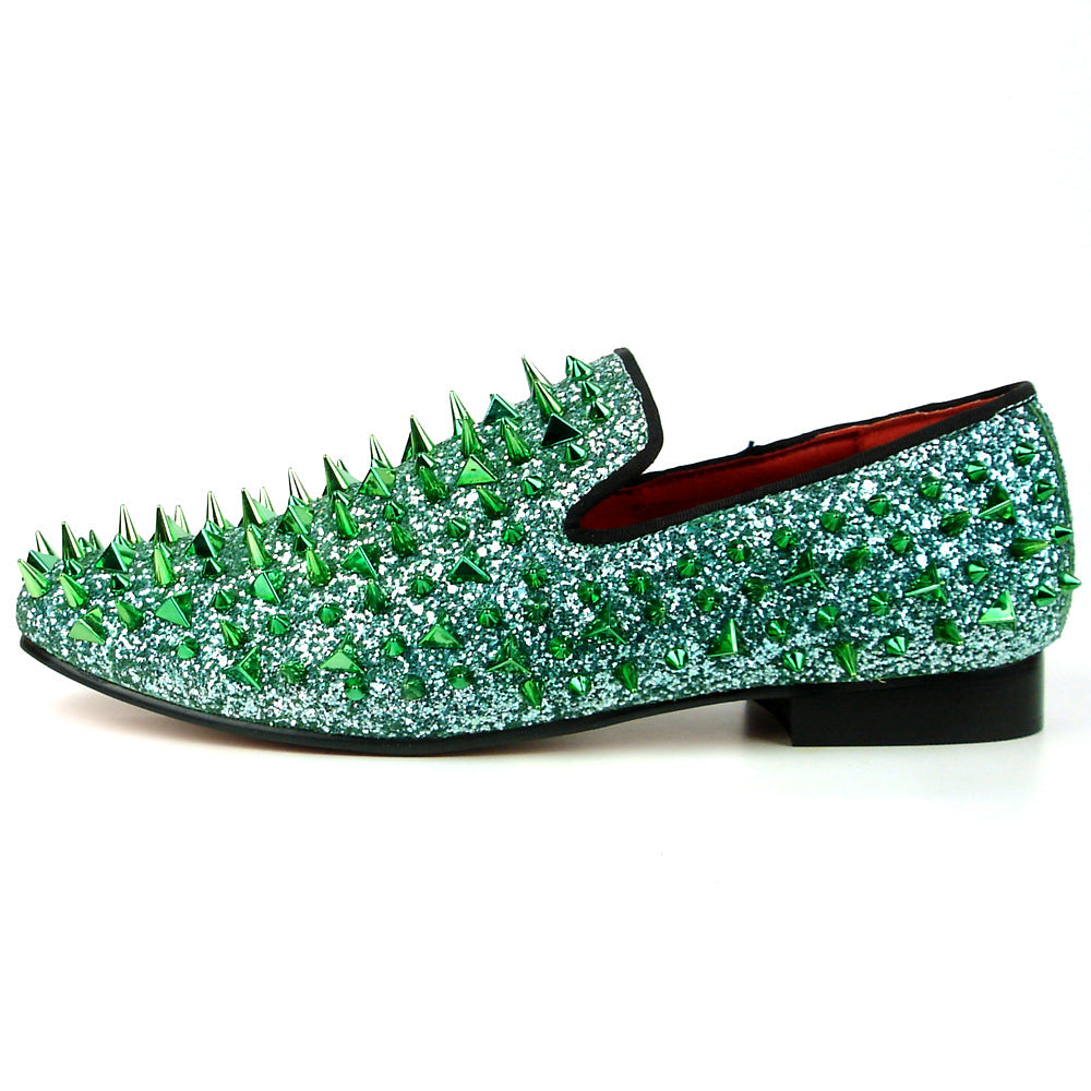 The FI-7239 Green Glitter Green Spikes Slip on Loafer by Fiesso features dazzling green glitter, metallic spikes, handcrafted leather details, a bold red lining, and a black sole—a standout piece for men's fashion.