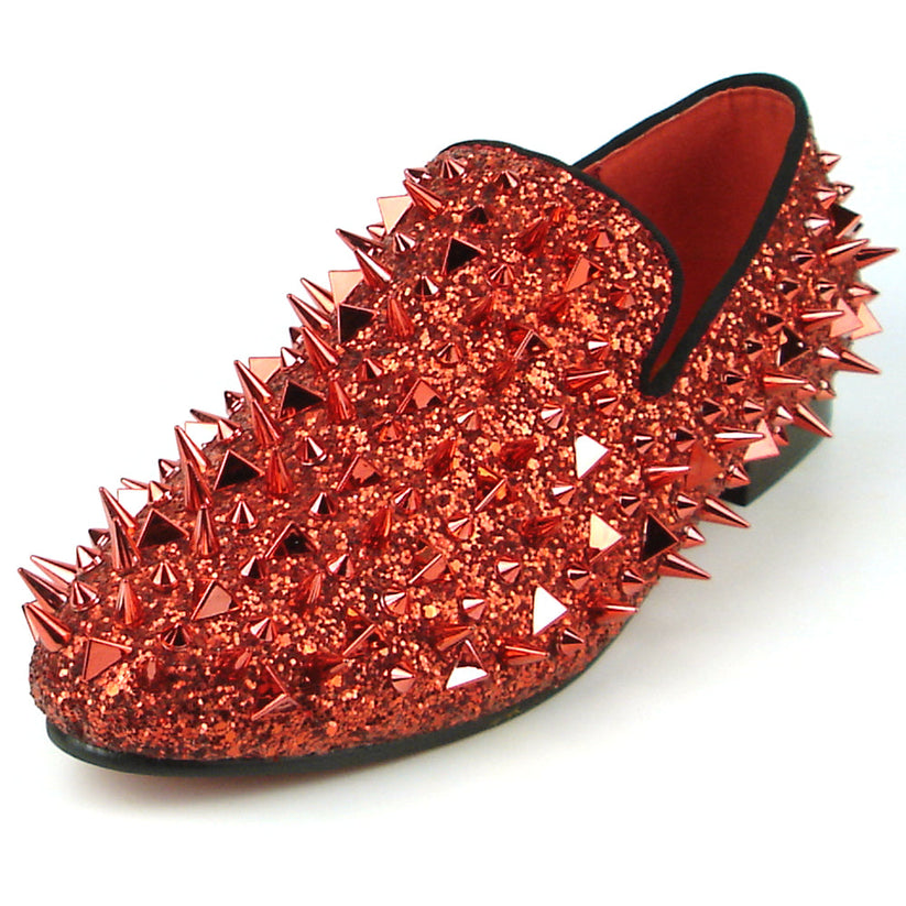 Introducing the FI-7239 Red Glitter Red Spikes by Fiesso, this striking slip-on shoe features a radiant red glitter finish and is adorned with an array of pointed metal spikes in various sizes. Crafted by Fiesso by Aurelio Garcia, this bold men’s fashion shoe redefines style boundaries with its handcrafted leather construction.