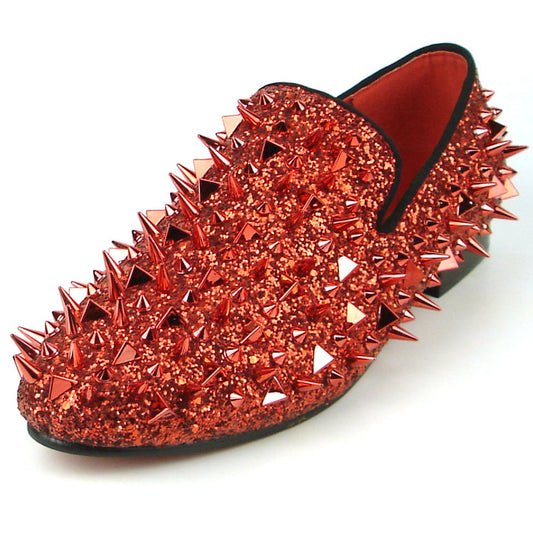 Introducing the FI-7239 Red Glitter Red Spikes by Fiesso, this striking slip-on shoe features a radiant red glitter finish and is adorned with an array of pointed metal spikes in various sizes. Crafted by Fiesso by Aurelio Garcia, this bold men’s fashion shoe redefines style boundaries with its handcrafted leather construction.