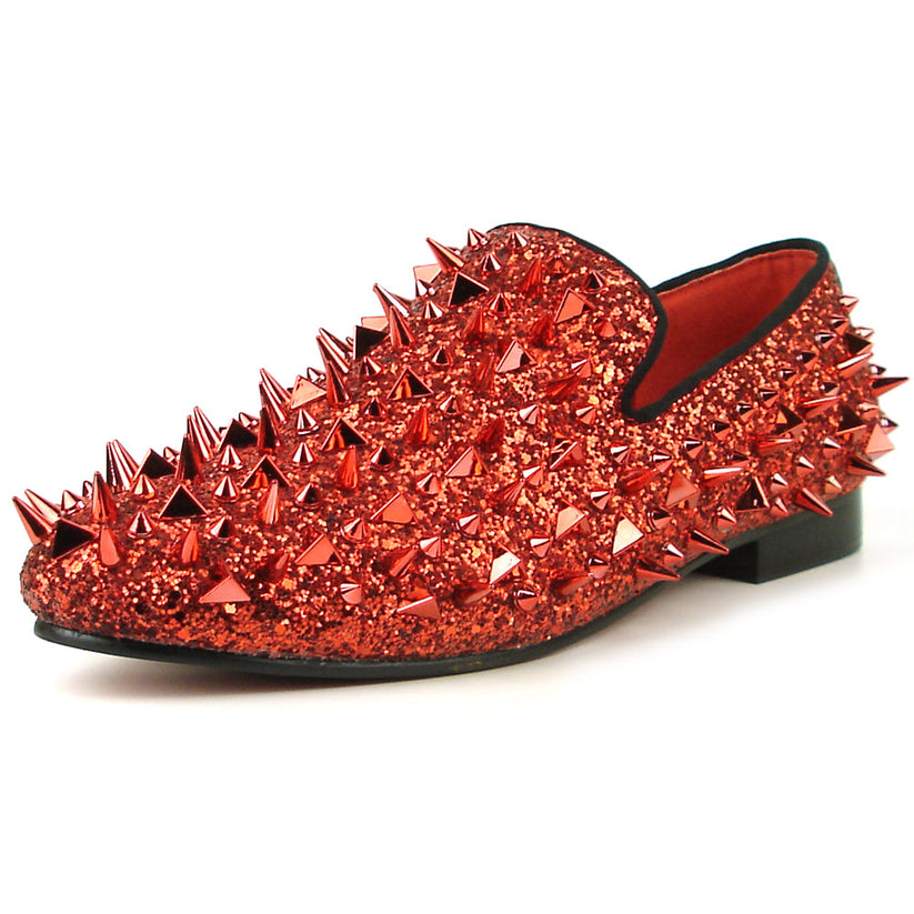 Introducing the FI-7239 Red Glitter Red Spikes by Fiesso, this striking slip-on shoe features a radiant red glitter finish and is adorned with an array of pointed metal spikes in various sizes. Crafted by Fiesso by Aurelio Garcia, this bold men’s fashion shoe redefines style boundaries with its handcrafted leather construction.