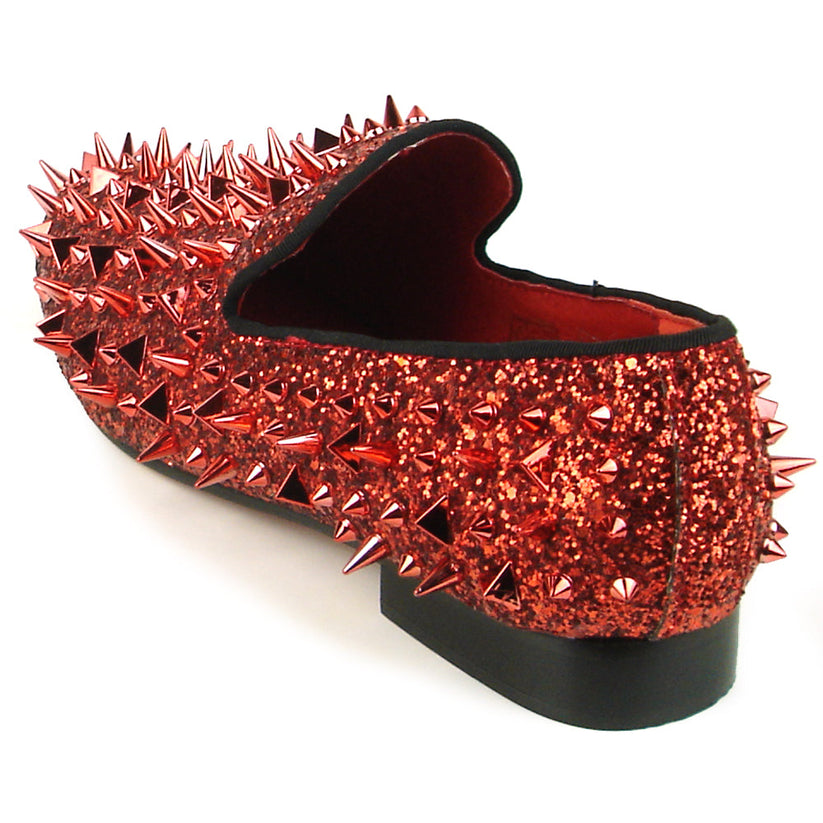 Introducing the FI-7239 Red Glitter Red Spikes by Fiesso, this striking slip-on shoe features a radiant red glitter finish and is adorned with an array of pointed metal spikes in various sizes. Crafted by Fiesso by Aurelio Garcia, this bold men’s fashion shoe redefines style boundaries with its handcrafted leather construction.