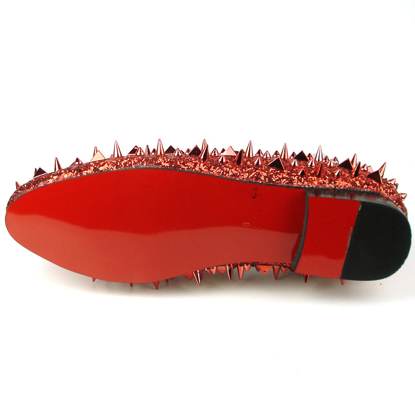 Introducing the FI-7239 Red Glitter Red Spikes by Fiesso, this striking slip-on shoe features a radiant red glitter finish and is adorned with an array of pointed metal spikes in various sizes. Crafted by Fiesso by Aurelio Garcia, this bold men’s fashion shoe redefines style boundaries with its handcrafted leather construction.