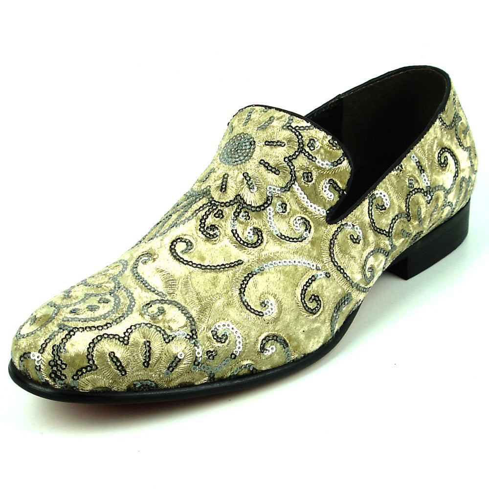 The FI-7363 Beige Slip-On Loafer by Fiesso features striking silver and black embroidered floral and swirl patterns with black trim—a standout men’s fashion piece from Fiesso.