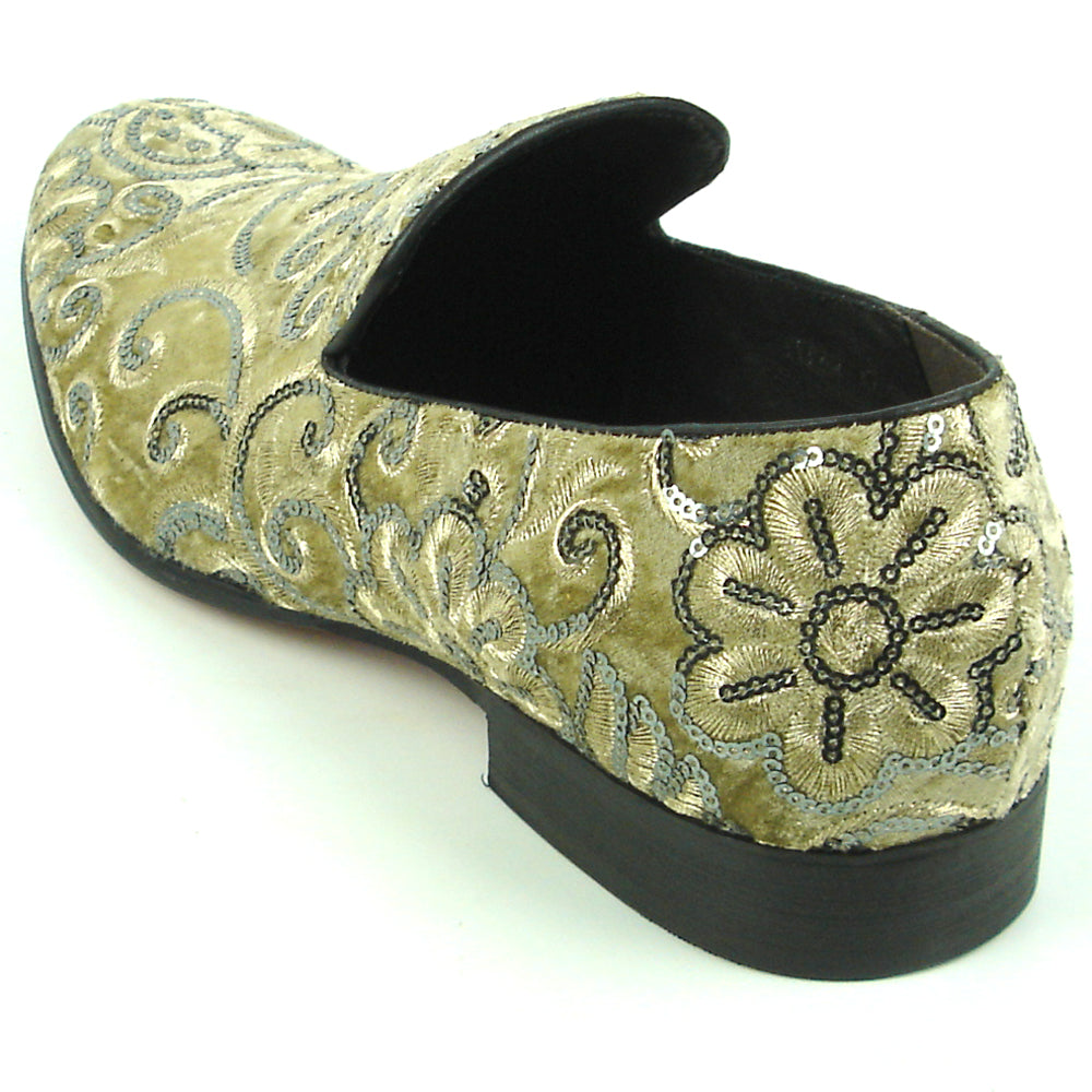 The FI-7363 Beige Slip-On Loafer by Fiesso features striking silver and black embroidered floral and swirl patterns with black trim—a standout men’s fashion piece from Fiesso.