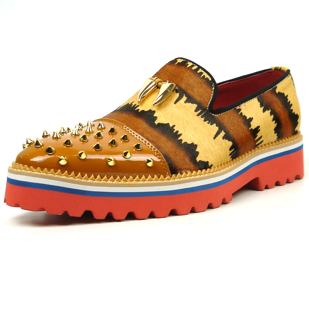 The FI-7455 Brown Cap Toe Spikes Slip On by Fiesso features gold spikes on a brown toe, animal print sides, red interior and sole, plus a bold blue stripe—a striking, handcrafted leather loafer for standout men’s style.