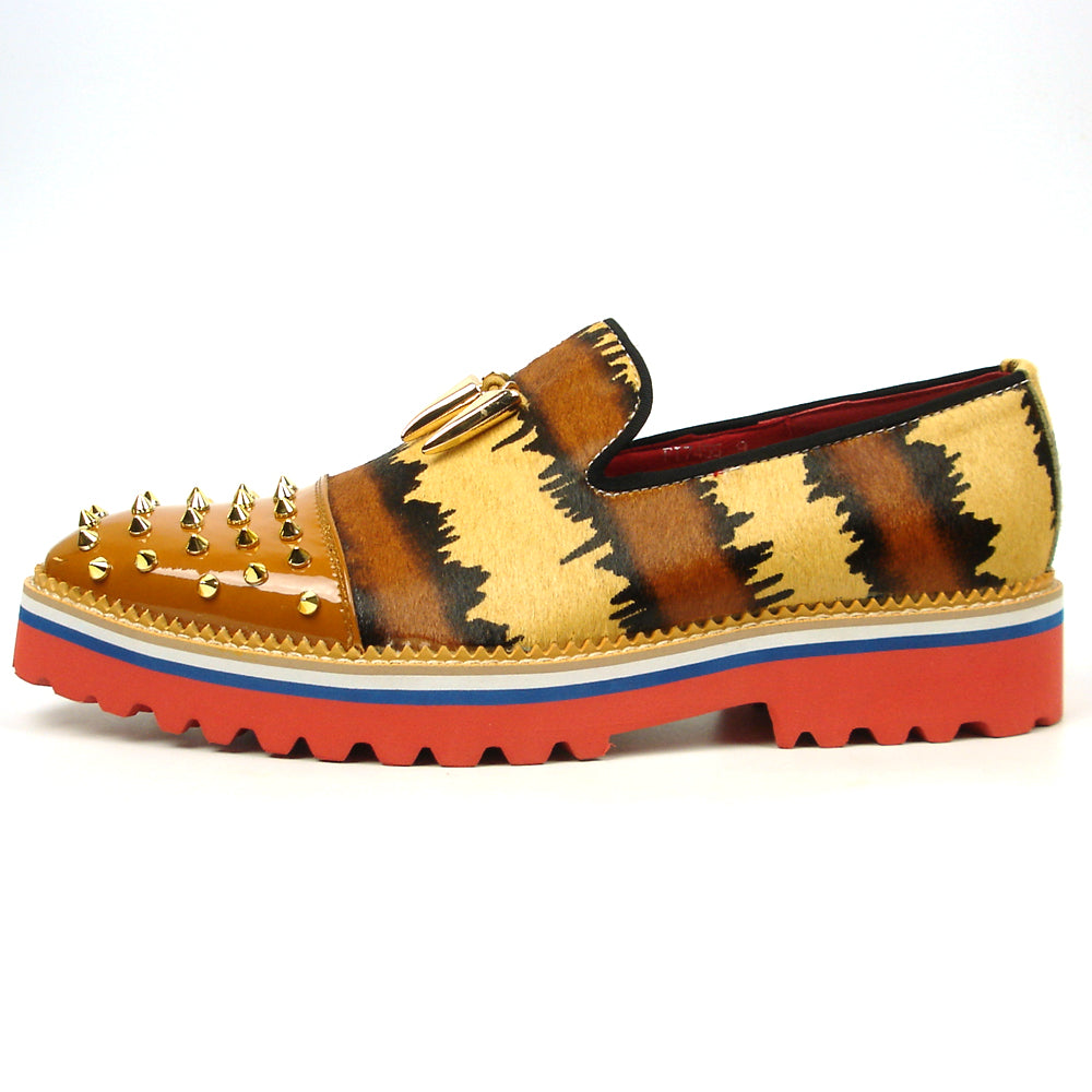 The FI-7455 Brown Cap Toe Spikes Slip On by Fiesso features gold spikes on a brown toe, animal print sides, red interior and sole, plus a bold blue stripe—a striking, handcrafted leather loafer for standout men’s style.