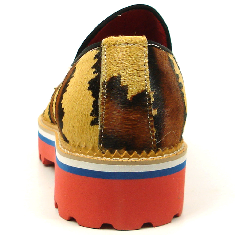 The FI-7455 Brown Cap Toe Spikes Slip On by Fiesso features gold spikes on a brown toe, animal print sides, red interior and sole, plus a bold blue stripe—a striking, handcrafted leather loafer for standout men’s style.