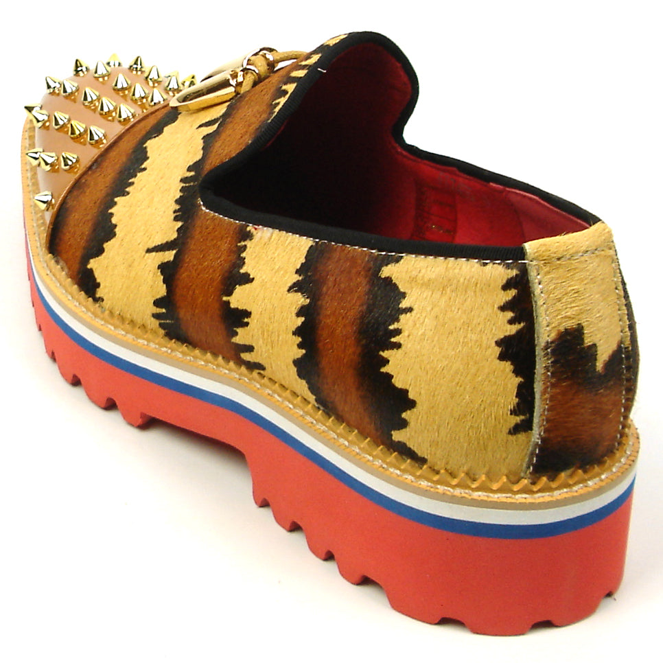 The FI-7455 Brown Cap Toe Spikes Slip On by Fiesso features gold spikes on a brown toe, animal print sides, red interior and sole, plus a bold blue stripe—a striking, handcrafted leather loafer for standout men’s style.