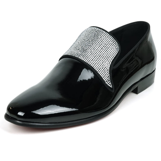 The FI-7549 Black Patent Rhinestones Slip on Loafer by Fiesso features a pointed toe and a flap with shiny silver studs, offering a bold update to the classic slip-on style.
