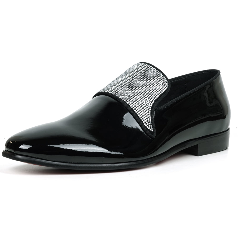 The FI-7549 Black Patent Rhinestones Slip on Loafer by Fiesso features a pointed toe and a flap with shiny silver studs, offering a bold update to the classic slip-on style.