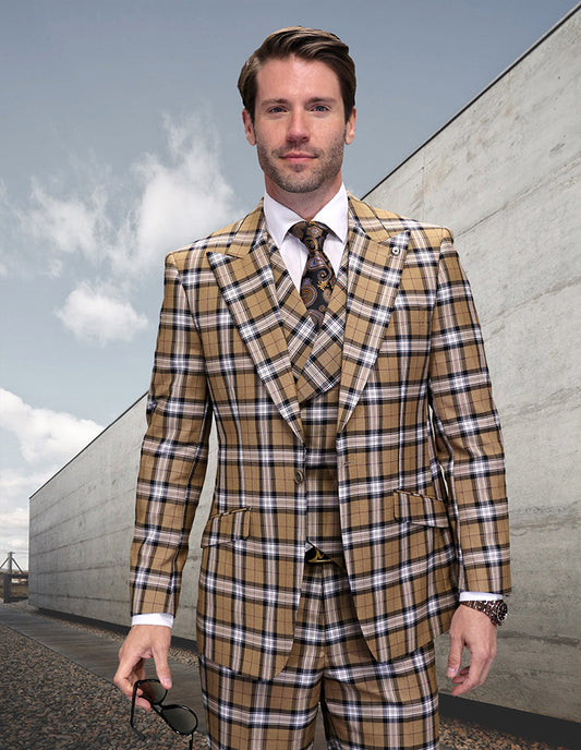 A man stands outdoors in the STATEMENT CLOTHING | GILANO-TAN suit by Statement Clothing—a tan, brown, and white plaid modern-fit ensemble with a matching vest and tie, peak lapels, and crafted from luxurious Italian wool. He holds sunglasses.