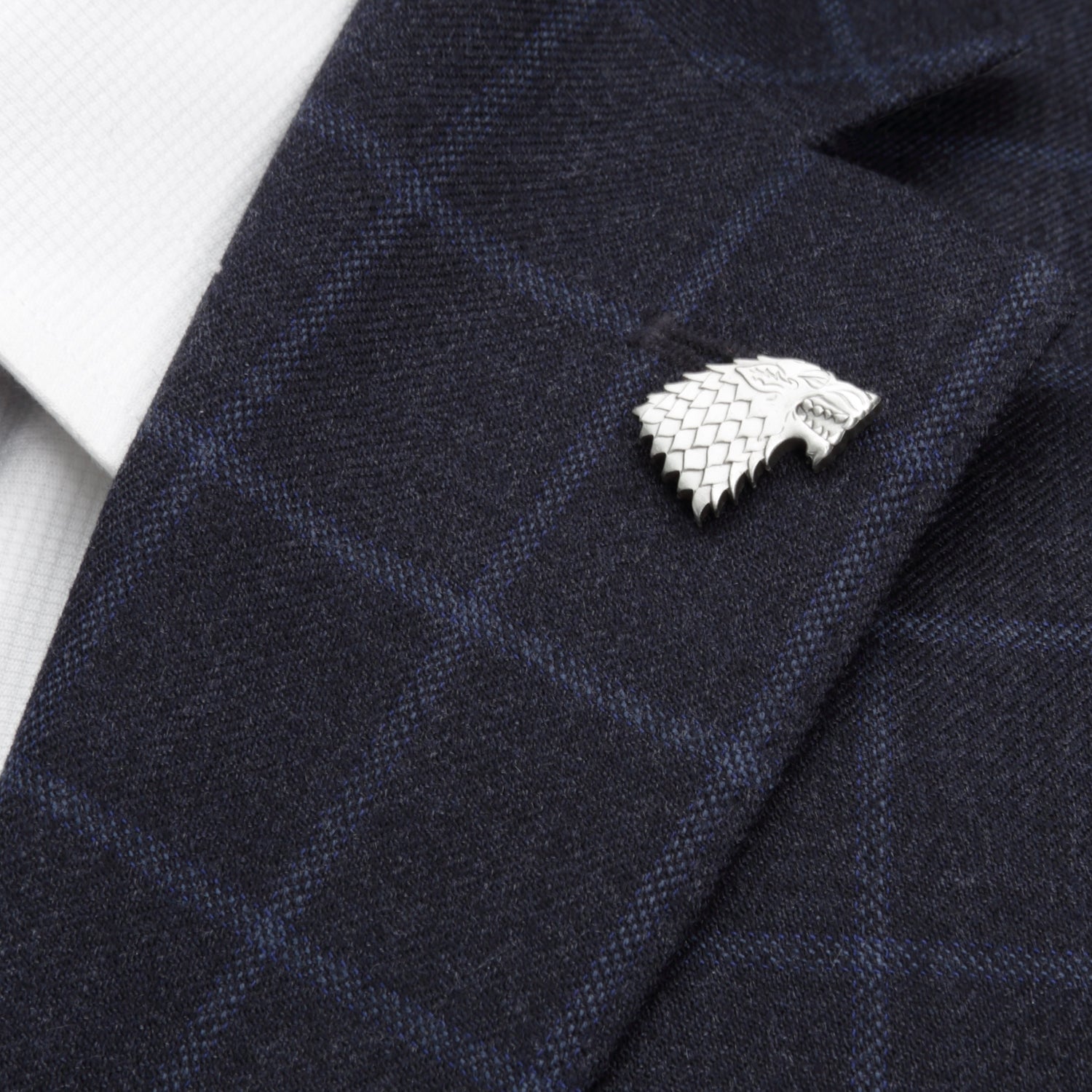 The Game of Thrones Stark Direwolf Antiqued Lapel Pin by Cufflinks.com features a detailed wolf's head, making it the ideal collectible for any House Stark or Game of Thrones fan.