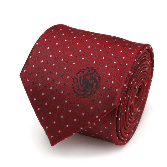 The Game of Thrones Targaryen Dragon Sigil Men's Tie by Cufflinks.com is a rolled-up red tie featuring small white polka dots and a black dragon emblem on the front.