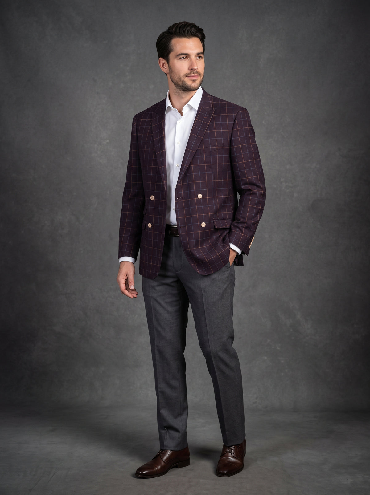 An Inserch Blazer 555-31 Burgundy, exclusive in a size 3XL, is neatly draped on a black hanger against the inviting hues of a wooden floor background.