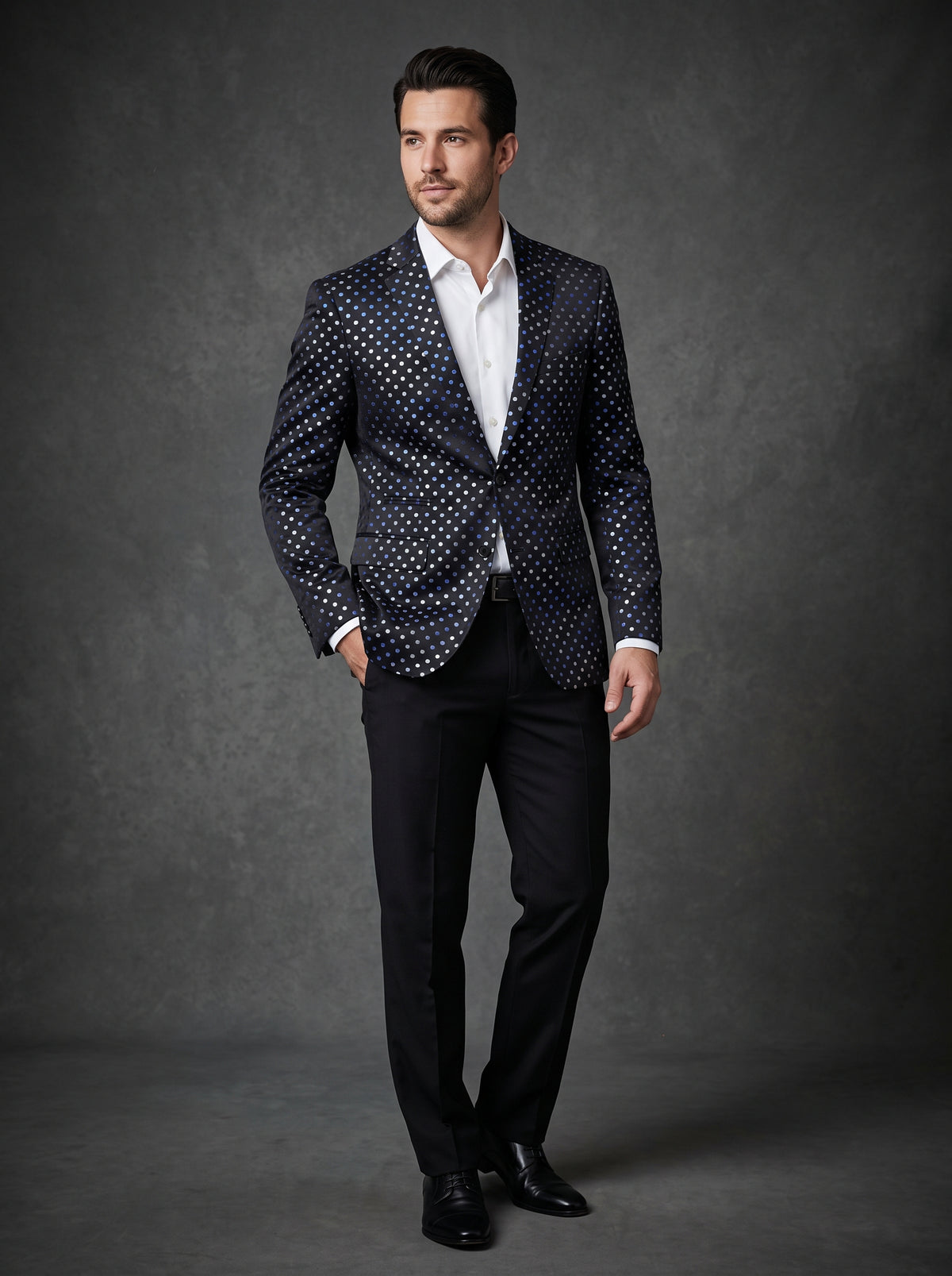 An Inserch Slim Fit Jacquard Blazer, model 573-01 in black, is displayed on a wooden hanger against a gray wood floor background.