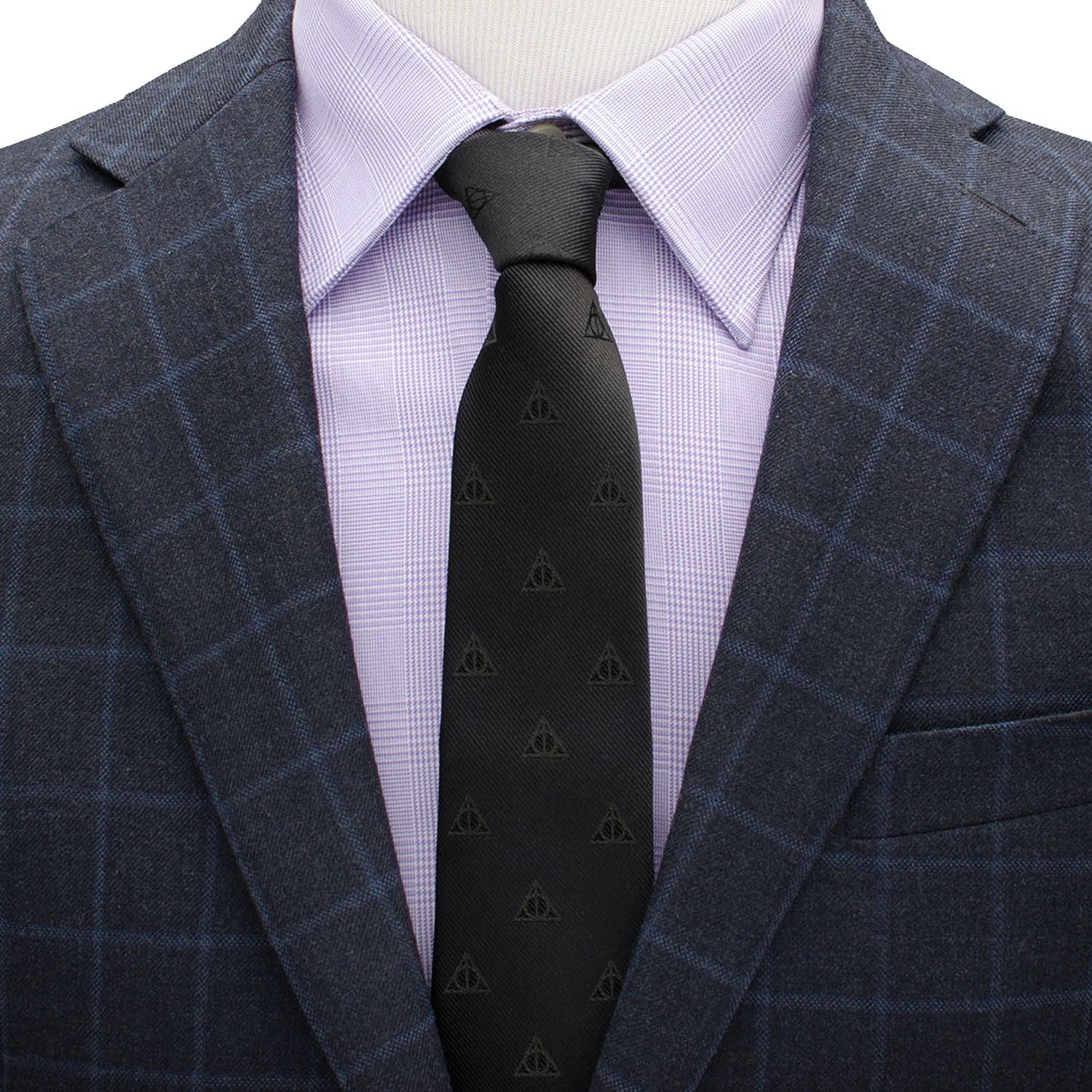 The Harry Potter Deathly Hallows Tie by Cufflinks.com is a black silk tie with a subtle, repeating pattern of small triangle symbols.
